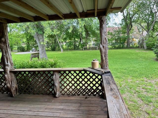 wooden deck with a yard