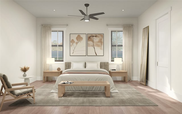 bedroom with ceiling fan and light wood-type flooring