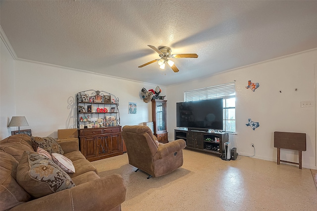 living room featuring ceiling fan, a textured ceiling, and ornamental molding