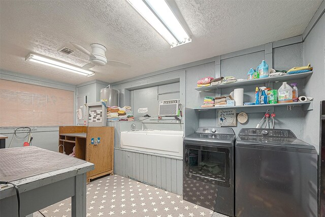 12320 Fm 1764th Rd, Santa Fe, TX 77510 - laundry area with washer and dryer, a textured ceiling, and ceiling fan