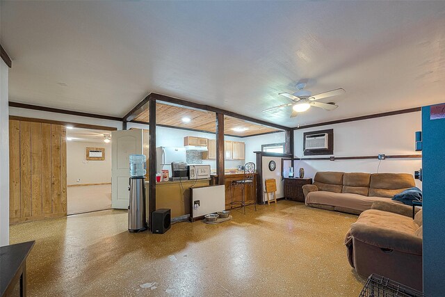 living room featuring a wall mounted air conditioner and ceiling fan