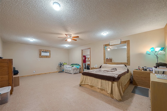 bedroom with light carpet, ceiling fan, and a textured ceiling