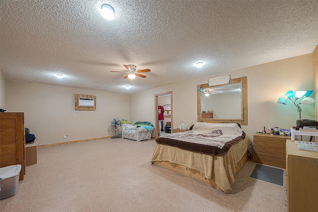 12320 Fm 1764th Rd, Santa Fe, TX 77510 - bedroom featuring a textured ceiling, a wall mounted AC, and ceiling fan