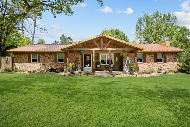 ranch-style home with a front lawn and a patio