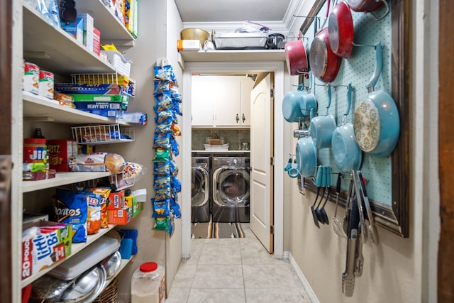 storage room featuring washing machine and clothes dryer