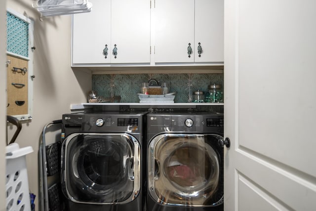 laundry area featuring cabinets and separate washer and dryer