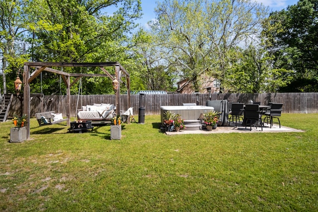 view of yard featuring an outdoor living space, a hot tub, and a patio area