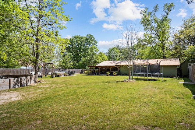 view of yard featuring a trampoline