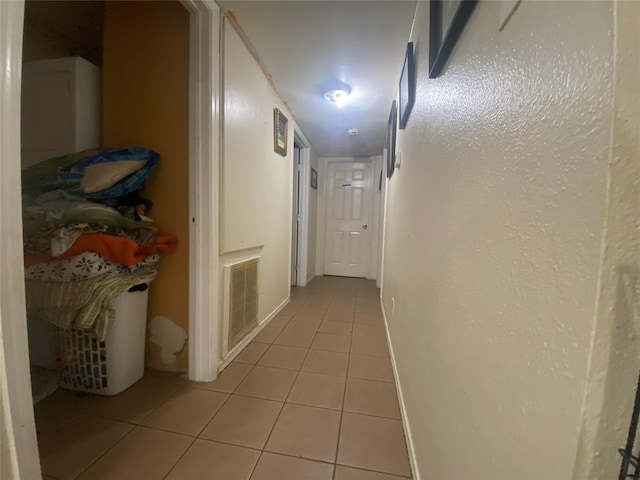 corridor featuring tile patterned floors