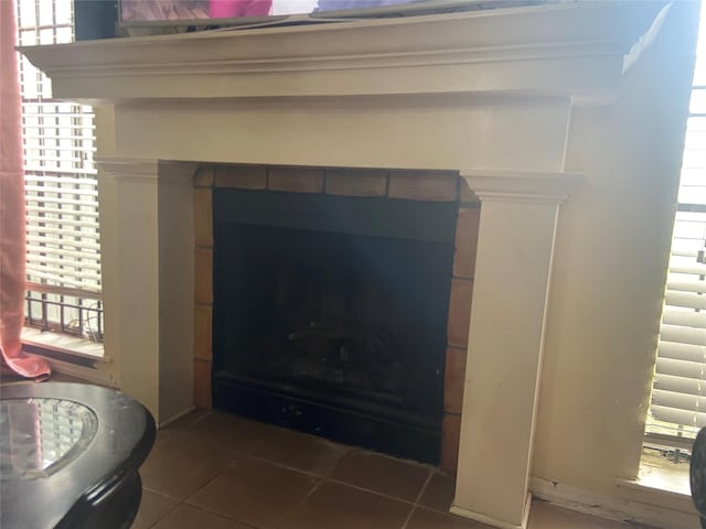 room details featuring a tile fireplace