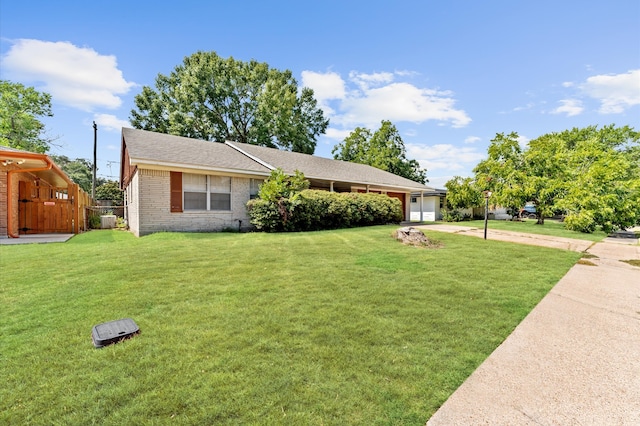 ranch-style house with a front yard