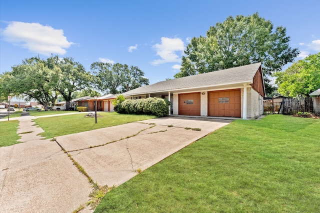 ranch-style home featuring a front lawn and a garage