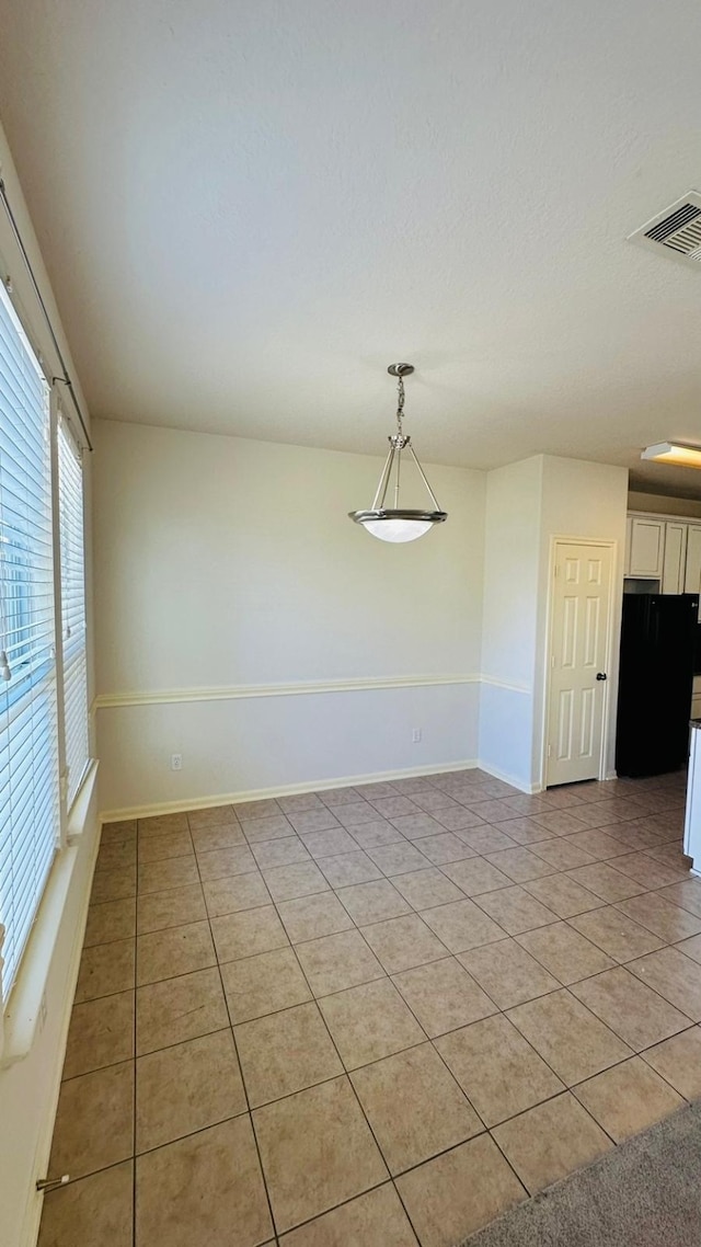 view of tiled spare room