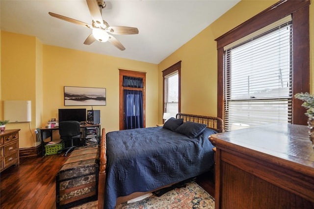 bedroom with ceiling fan and dark wood-type flooring