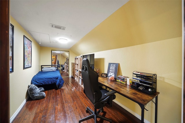 office space with vaulted ceiling and dark hardwood / wood-style flooring