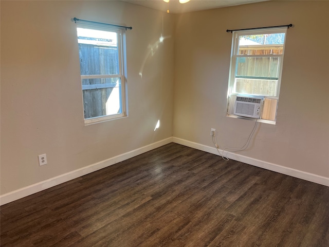 spare room featuring dark hardwood / wood-style floors