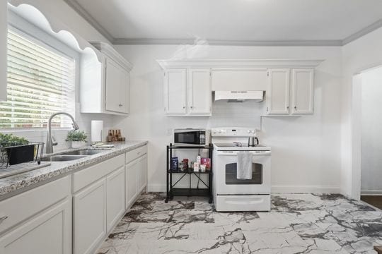 kitchen featuring crown molding, white range with electric cooktop, sink, and white cabinets