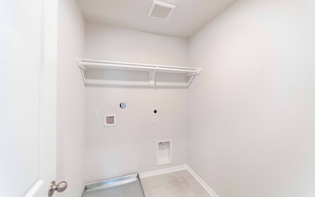 laundry room featuring hookup for a gas dryer, hookup for an electric dryer, light tile patterned flooring, and washer hookup