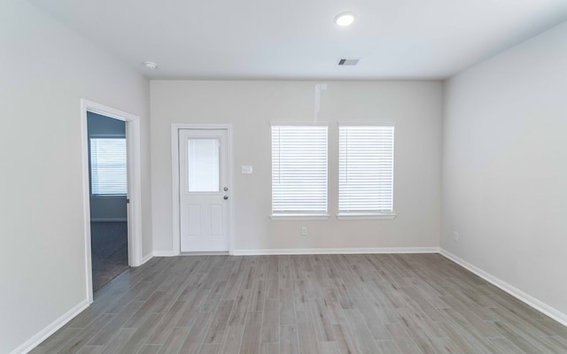 spare room featuring light wood-type flooring