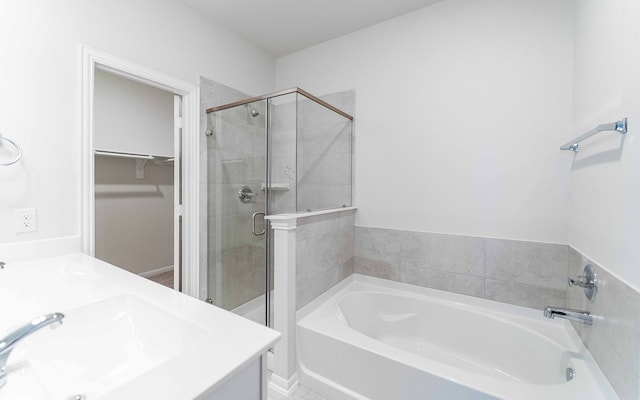 bathroom with shower with separate bathtub