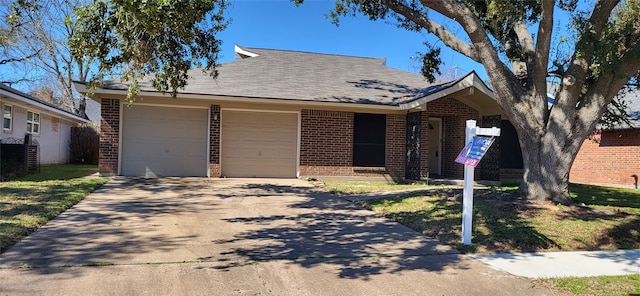 single story home featuring a front lawn, central AC unit, and a garage