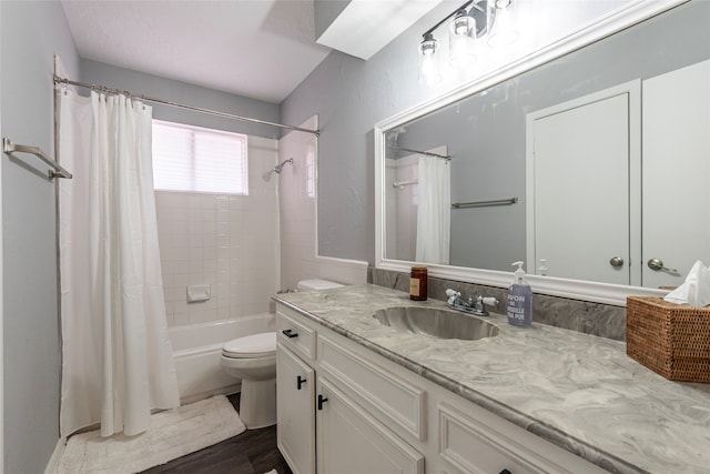 full bathroom with vanity, shower / bath combo with shower curtain, toilet, and hardwood / wood-style flooring