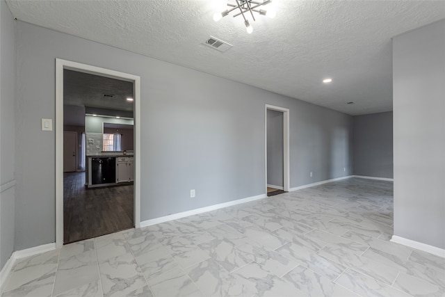 empty room with a textured ceiling