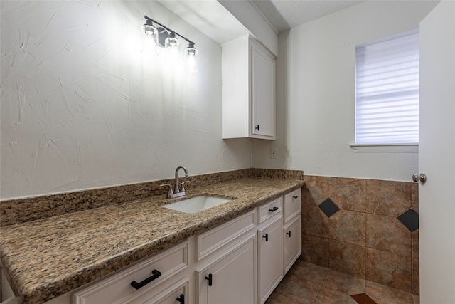 bathroom with vanity and tile patterned flooring