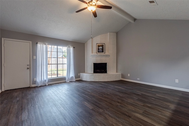 unfurnished living room featuring vaulted ceiling with beams, a textured ceiling, dark hardwood / wood-style flooring, a brick fireplace, and ceiling fan