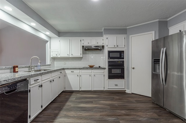 kitchen featuring light stone counters, dark hardwood / wood-style flooring, white cabinetry, black appliances, and sink