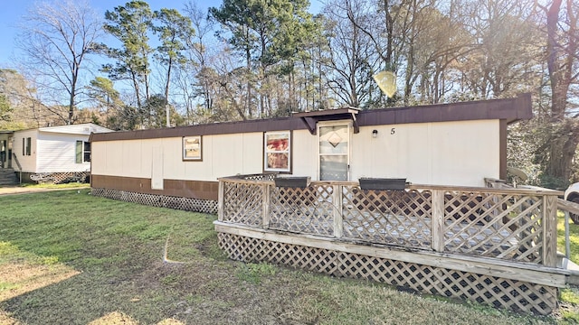 view of front of property featuring central air condition unit, a front lawn, and a wooden deck