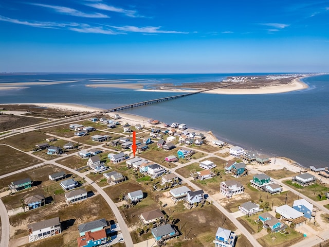 bird's eye view featuring a view of the beach and a water view