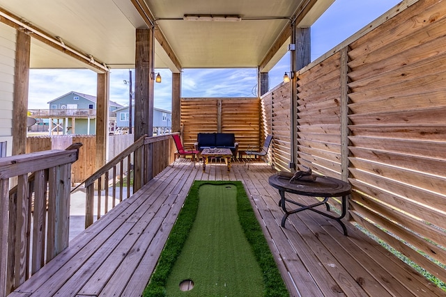 wooden terrace with outdoor lounge area