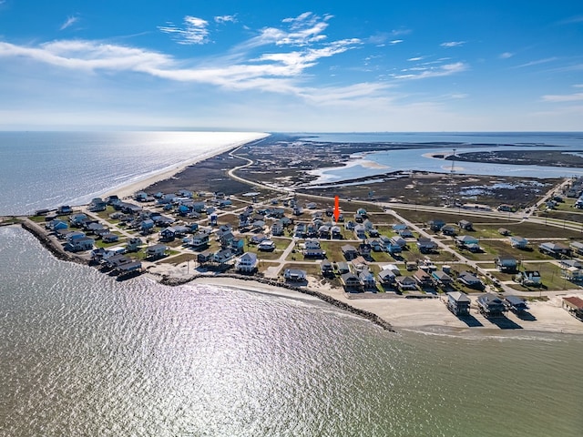 bird's eye view featuring a beach view and a water view