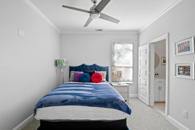 carpeted bedroom featuring ensuite bath, crown molding, and ceiling fan