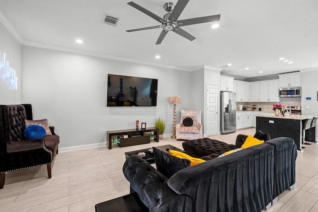 living room featuring crown molding and ceiling fan