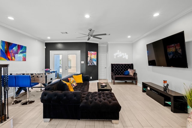 living room featuring french doors, light hardwood / wood-style floors, ornamental molding, and ceiling fan