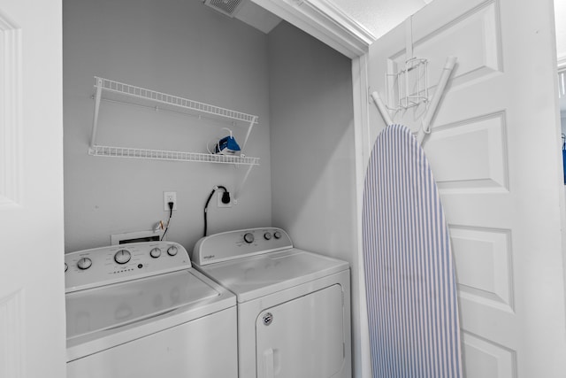 washroom featuring hookup for a washing machine and separate washer and dryer