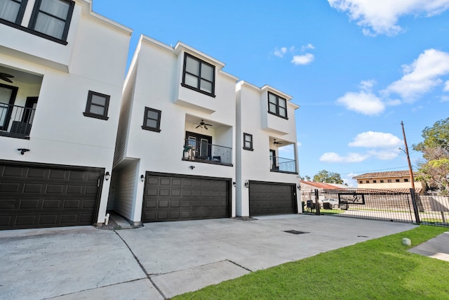 view of property exterior with a balcony and a garage