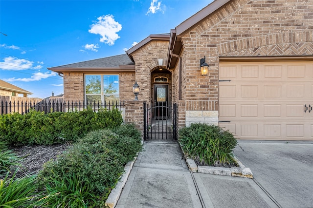 view of exterior entry with a garage