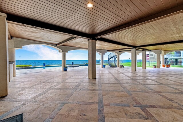 view of terrace with a water view