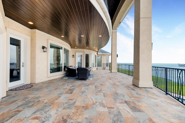 view of patio / terrace featuring a water view