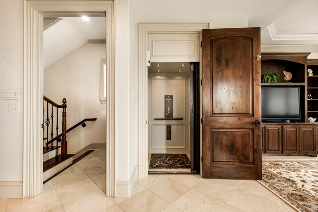 interior space with elevator and tile flooring