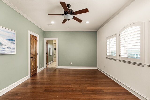 unfurnished room with dark hardwood / wood-style floors, ornamental molding, and ceiling fan