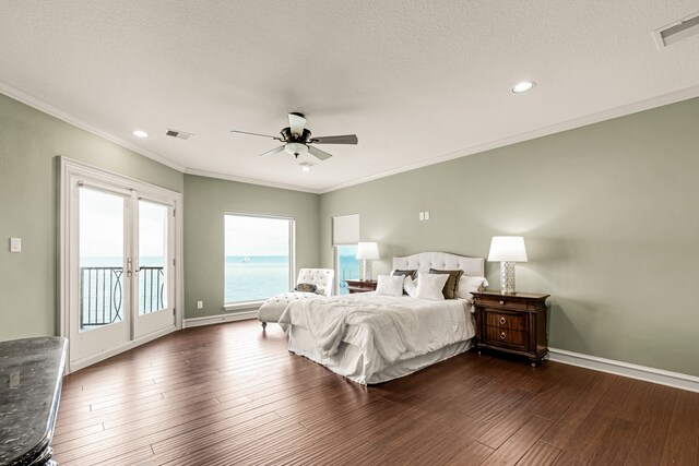 bedroom featuring ceiling fan, dark hardwood / wood-style flooring, access to outside, crown molding, and french doors