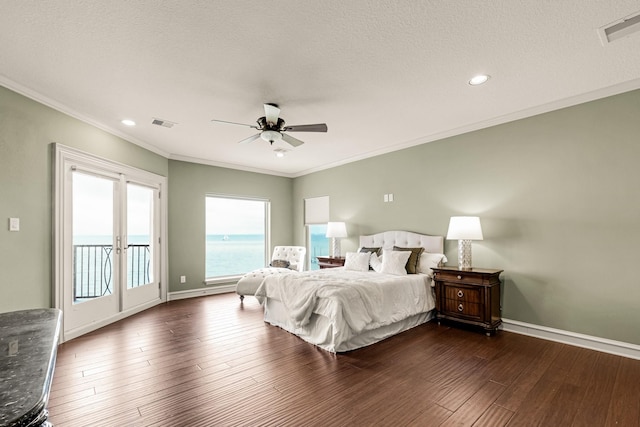 bedroom featuring dark hardwood / wood-style flooring, crown molding, access to outside, and a textured ceiling