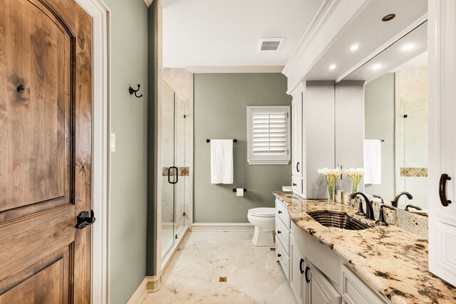 bathroom featuring toilet, oversized vanity, walk in shower, crown molding, and tile flooring