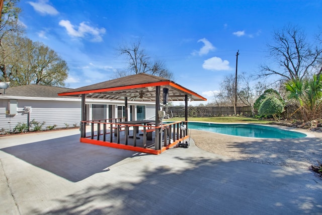 view of pool featuring a patio, a gazebo, and a deck