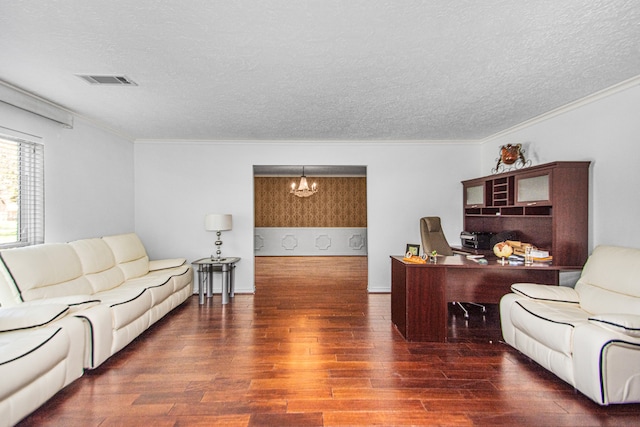 living room with an inviting chandelier, a textured ceiling, crown molding, and dark hardwood / wood-style floors