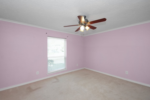 unfurnished room featuring light carpet, crown molding, a textured ceiling, and ceiling fan